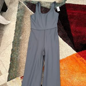 Old navy jumpsuit…flared bottom. Will look high water if you’re taller. Suit-4ft